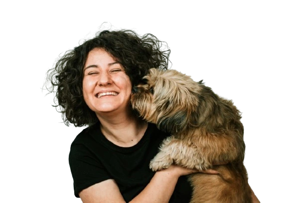 Woman hugging a brown dog